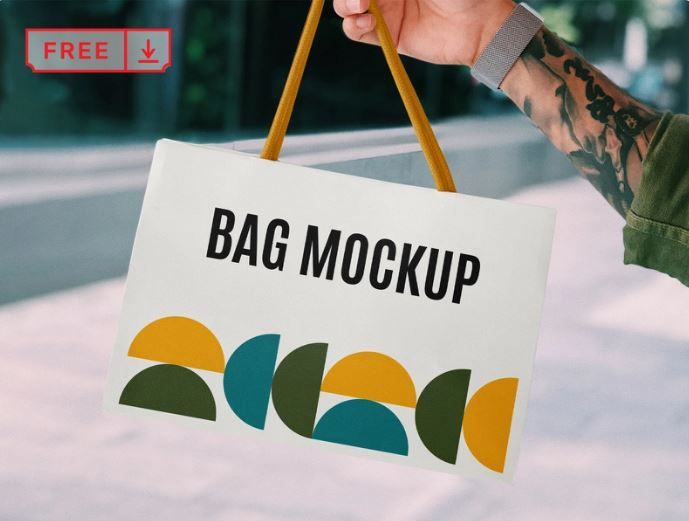 Hand-holding paper bag mockup