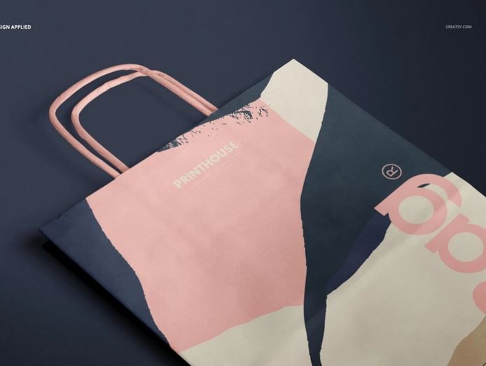 Lying down paper bag with handles mockup